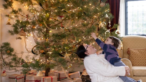 Family exploring the Christmas decorations at Godolphin, Cornwall,